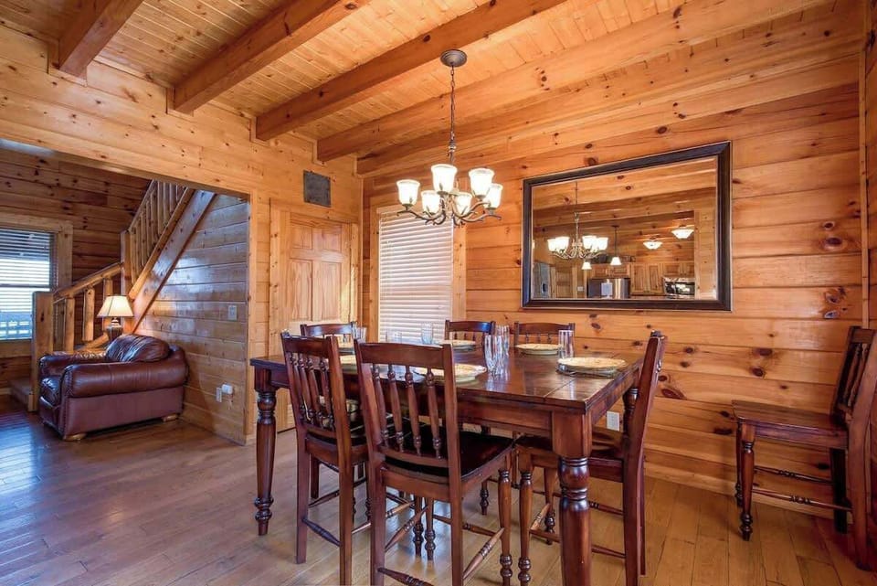 Your Table Awaits - The dining table seats six with room to spare, and another three can sit at the breakfast bar just a few steps away. There is also a table on the deck for alfresco dining.
