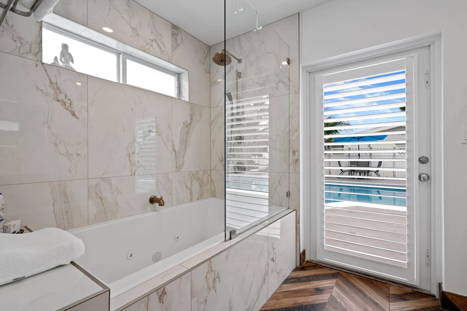 Luxurious large master jetted bathtub/shower combos- fits 2 adults comfortably.
