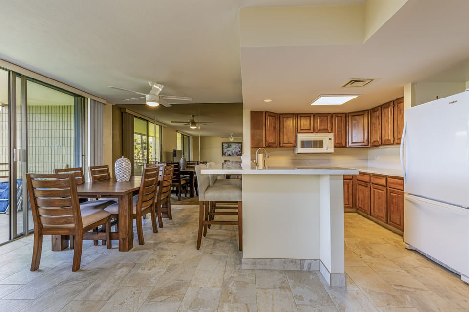 The kitchen opens to the dining area