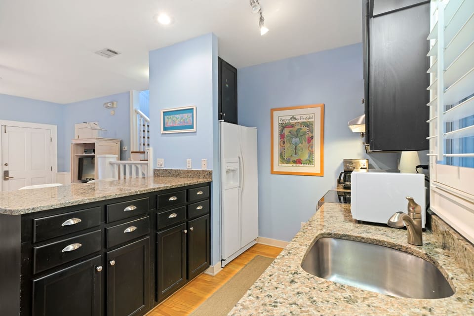 KITCHEN W/ GRANITE COUNTERS & PLENTY OF STORAGE