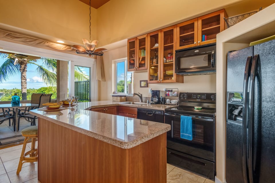 Very well appointed kitchen that opens to ocean views off the lanai.