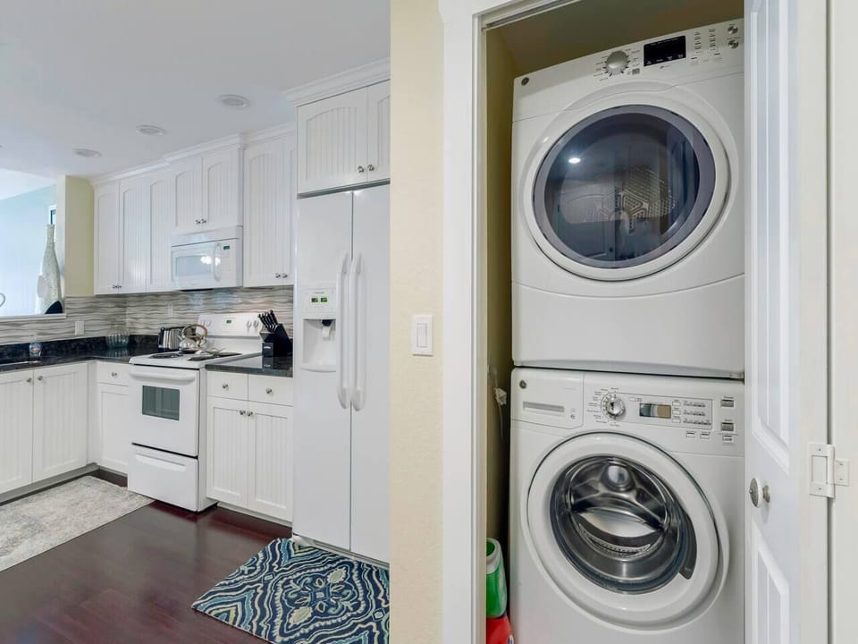 Full size stackable washer and dryer is provided for your convenience.