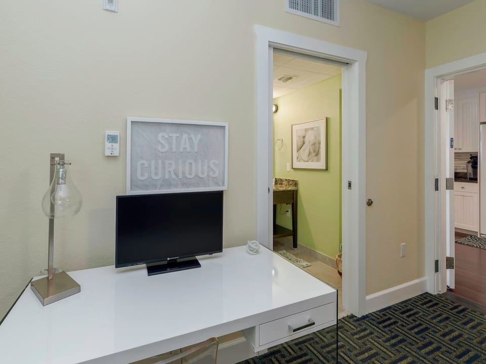 Front bedroom - work station, attached bathroom located off the kitchen