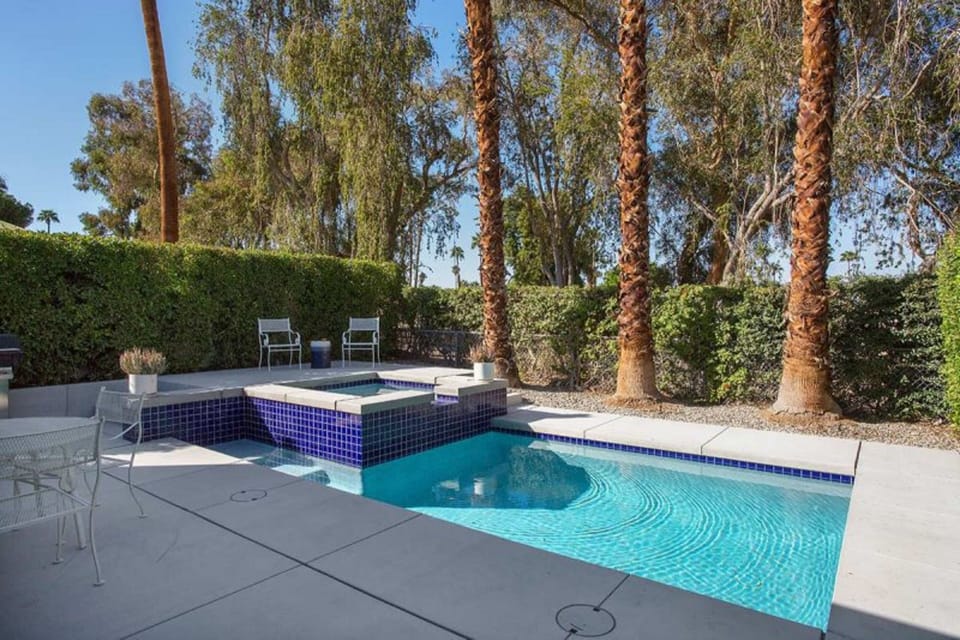 Modern Pool With Raised Spa and Waterfall Feature