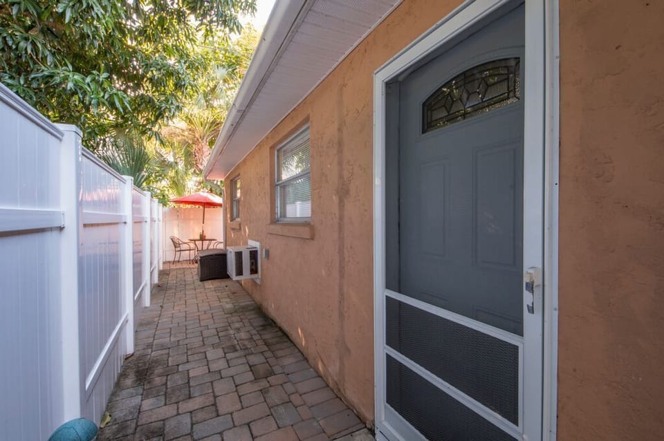 Front door is behind the Gate marked B on the left side of the house.