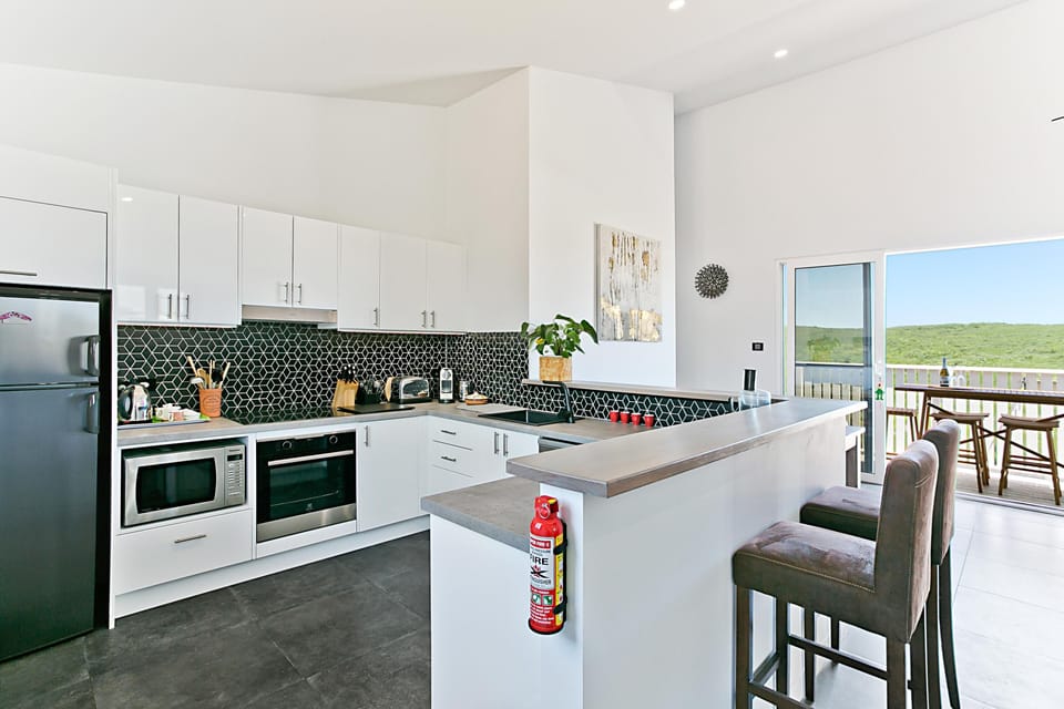 The fully fitted kitchen complete with fridge freezer, oven and induction cookto