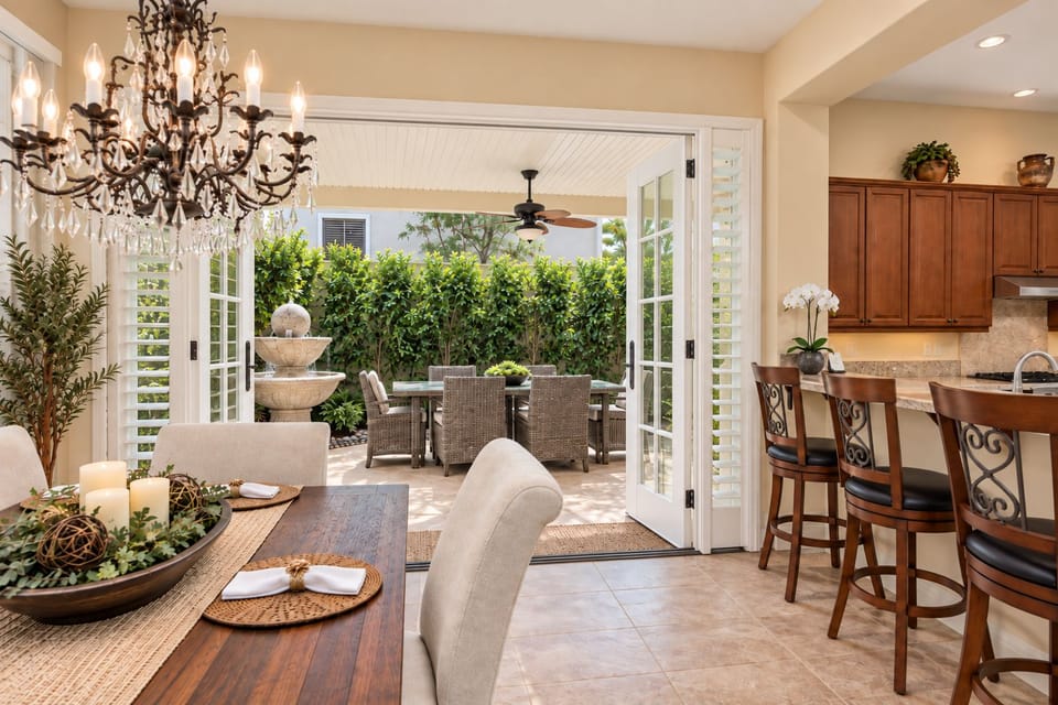 Elegant indoor-outdoor dining through French doors, perfect for entertaining