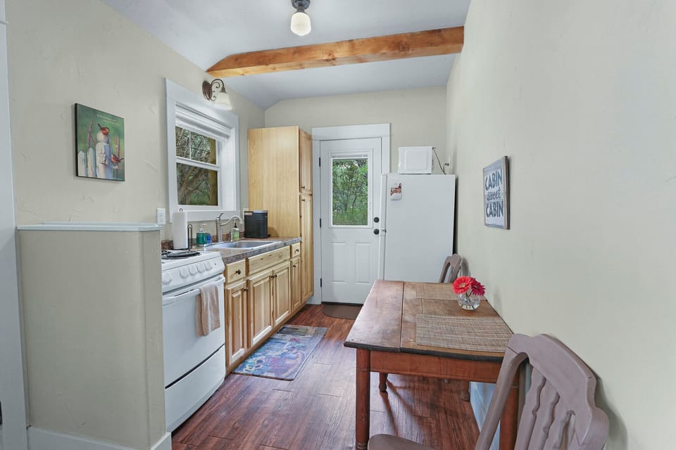 Table and chairs on the way to the kitchen