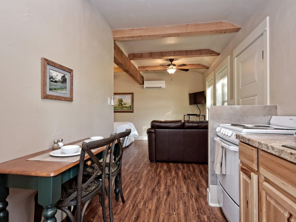 Looking from side door through kitchen to living area