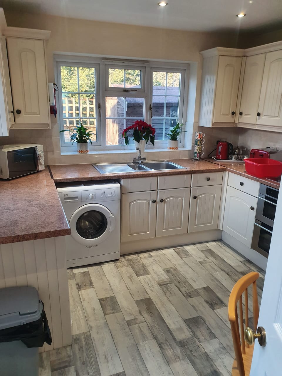 sunny kitchen with access onto patio..