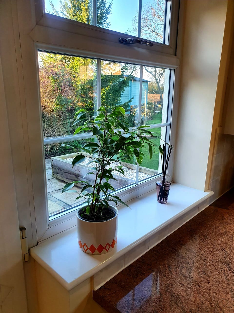 View from kitchen side window onto garden and open fields