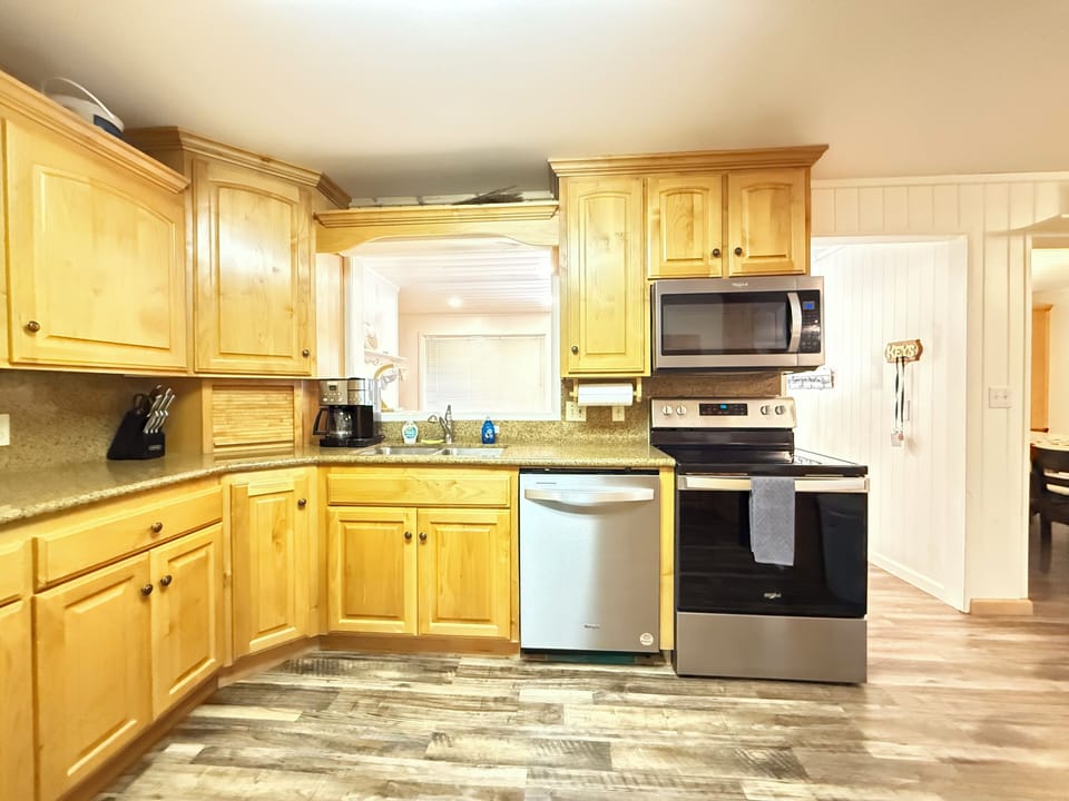 This full kitchen has appliances, dishes, and basic kitchen essentials to prepare meals during your stay.
