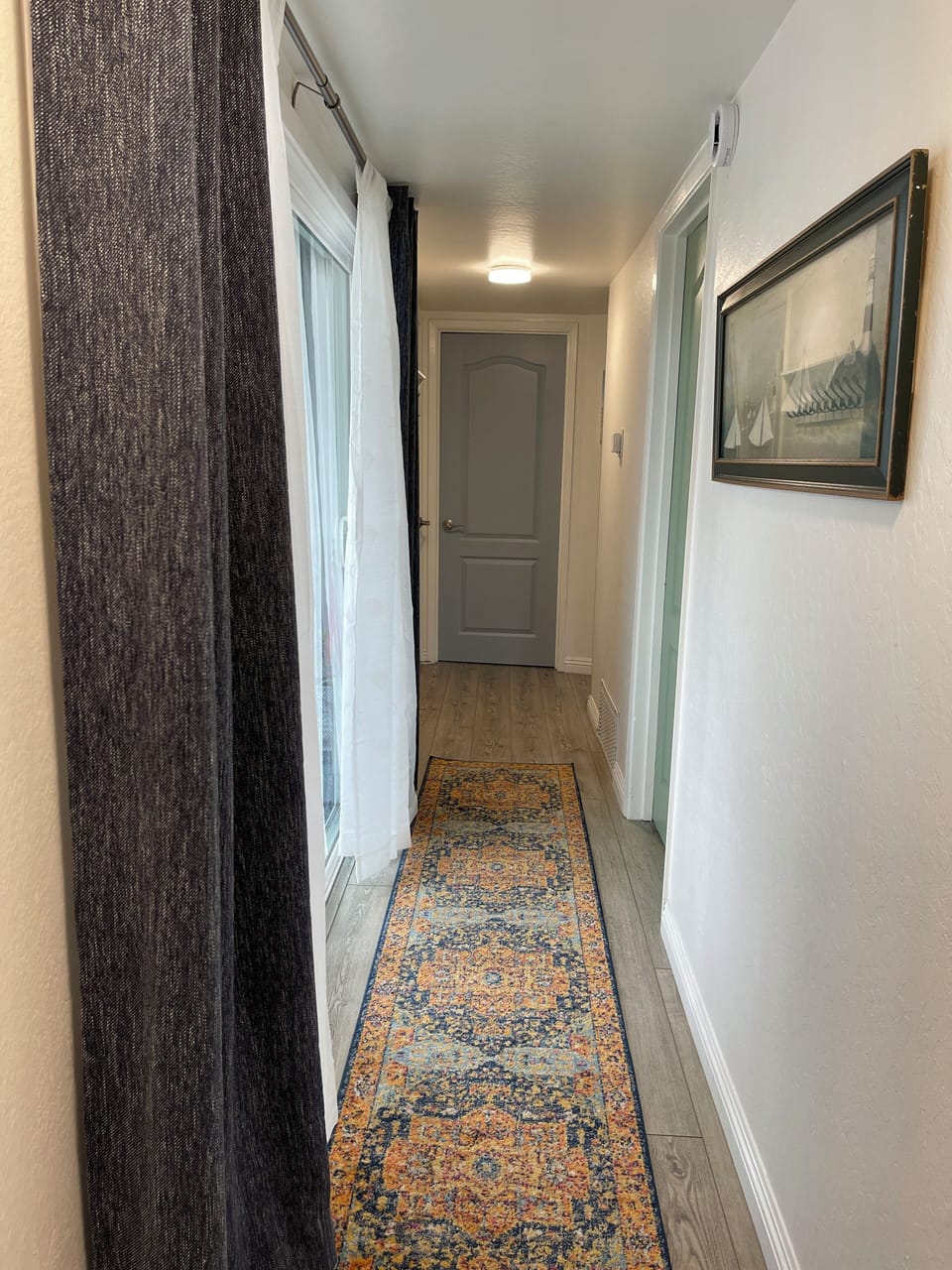 Hallway, entryway from front door slider to bedrooms and bathroom.