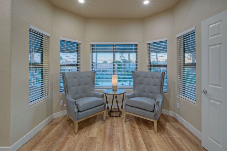 Sitting area in the primary suite offers a secluded place to sip morning coffee or evening nightcaps.