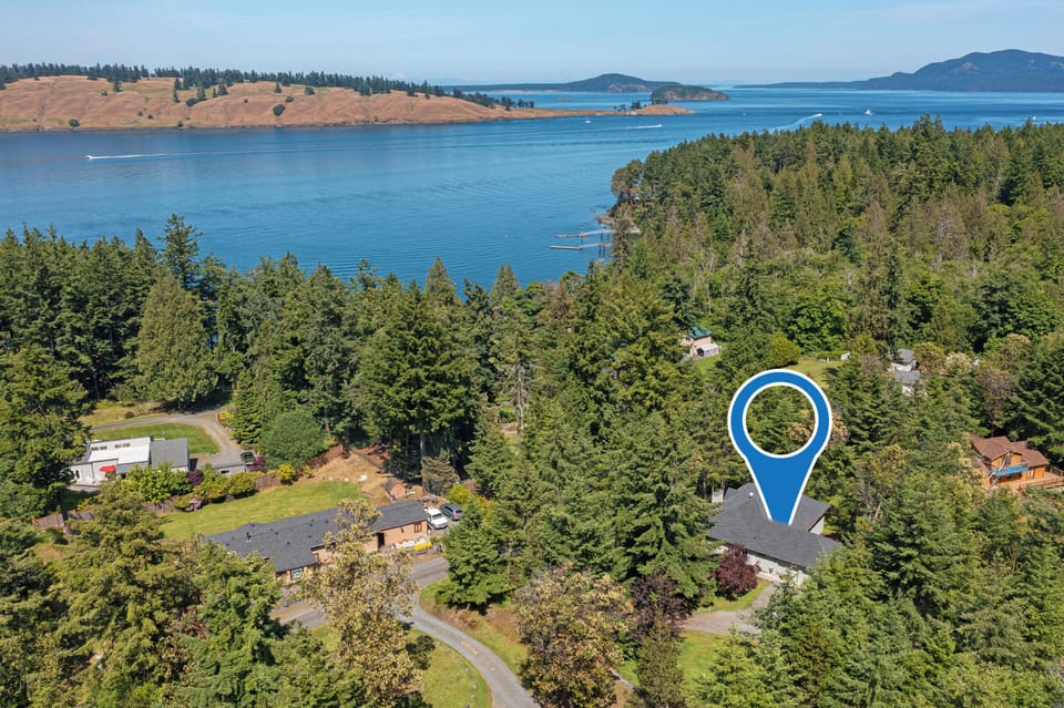Birds eye view of home & where it's situated to the water. No access that  beach