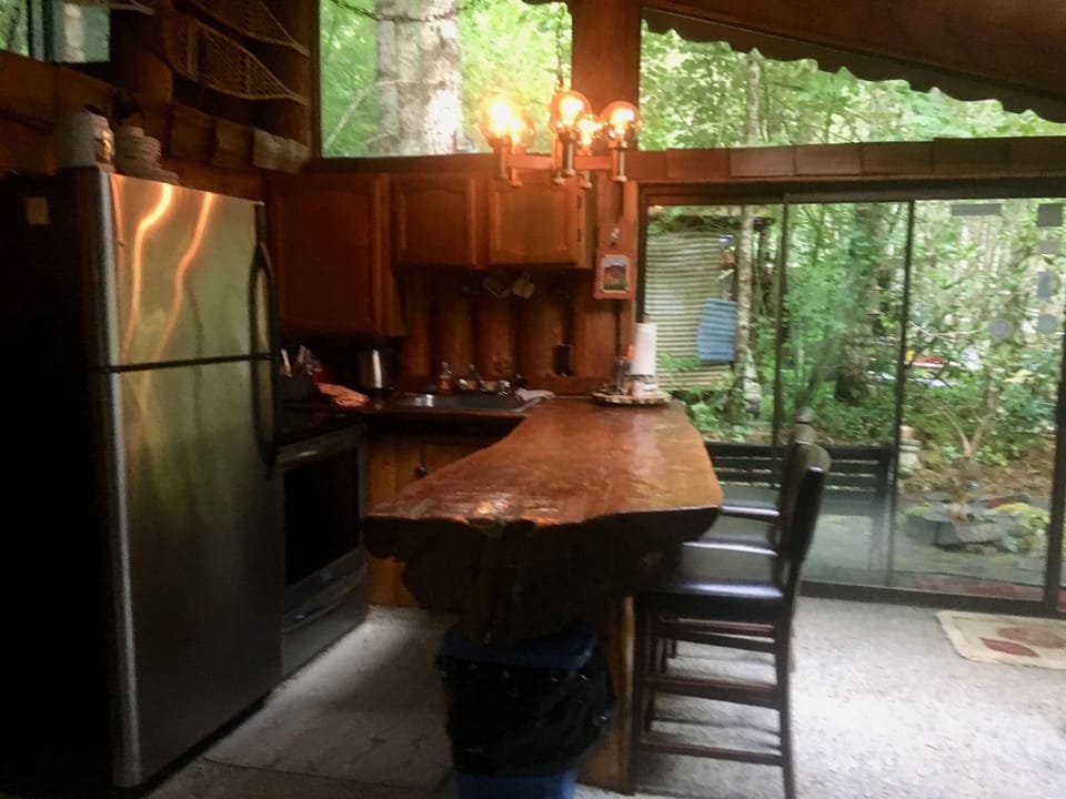 Kitchen has dishes and utensils in this space. Full sz oven stove & refer 