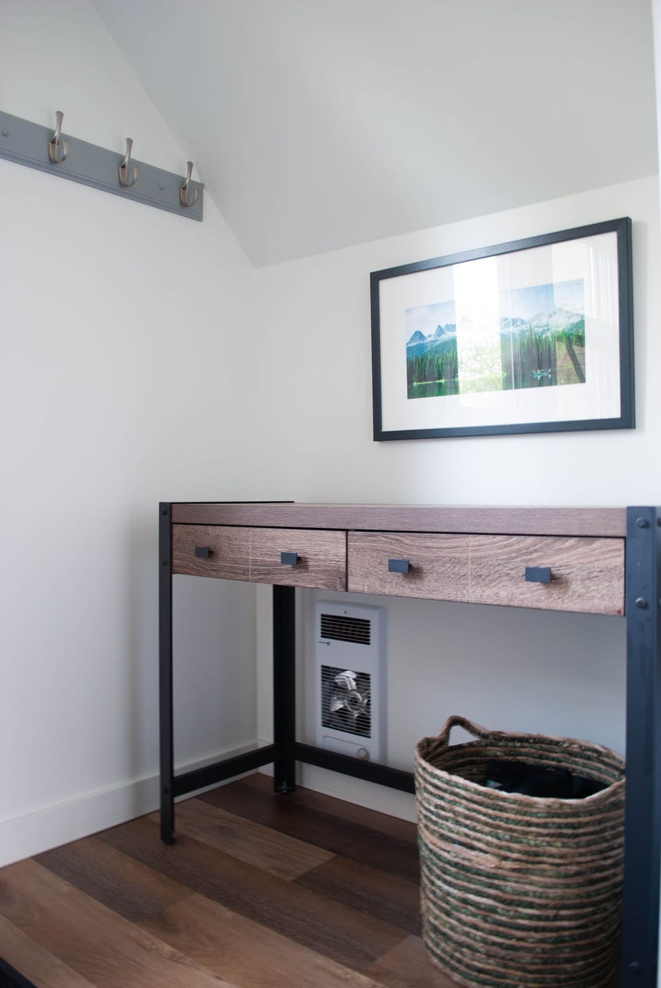 Entryway with coat hooks, entry table with 2 drawers.