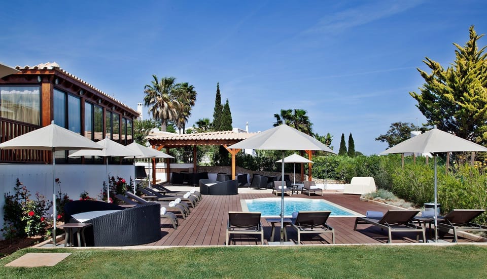 Lounge by the pool in the sunshine.