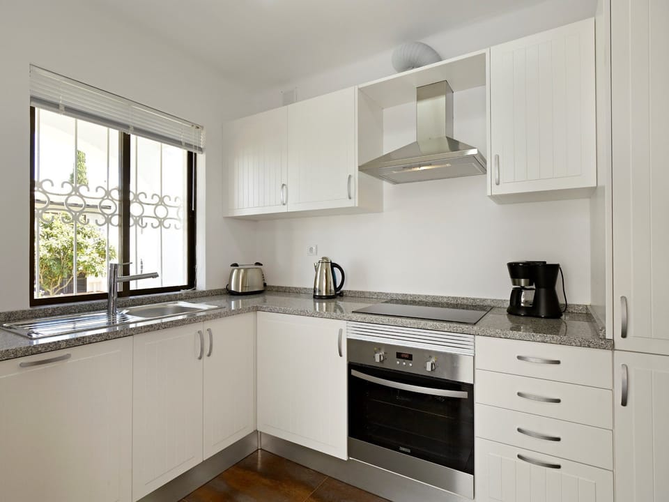 Curb your appetite by cooking a meal in your kitchen.