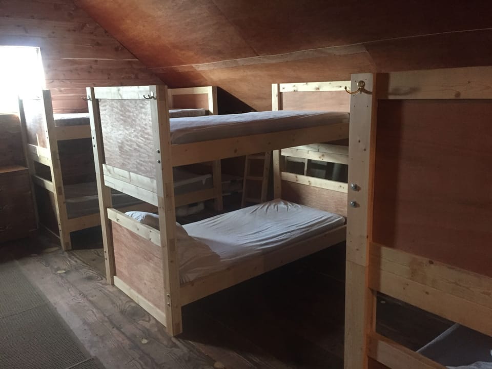 Bedroom loft area with 6 sets of bunk beds.