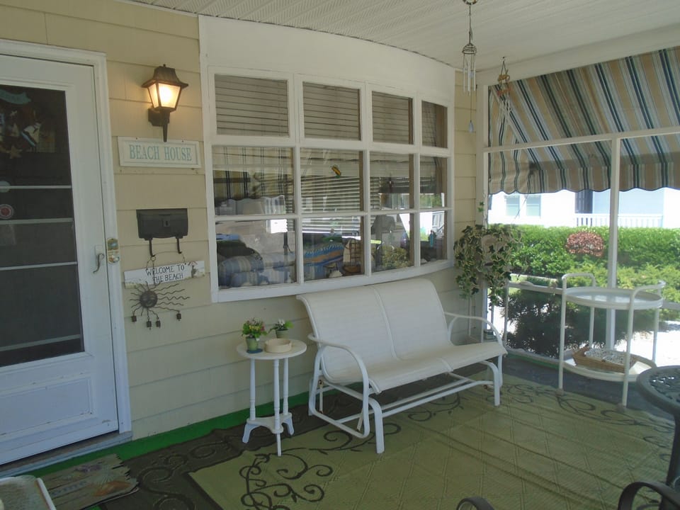 Shady & breezy front porch is comfortable place to socialize in the open air!