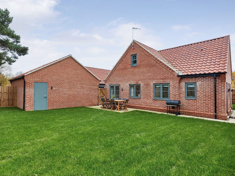 Lawned garden area with patio | Seasalt, Mundesley, near North Walsham