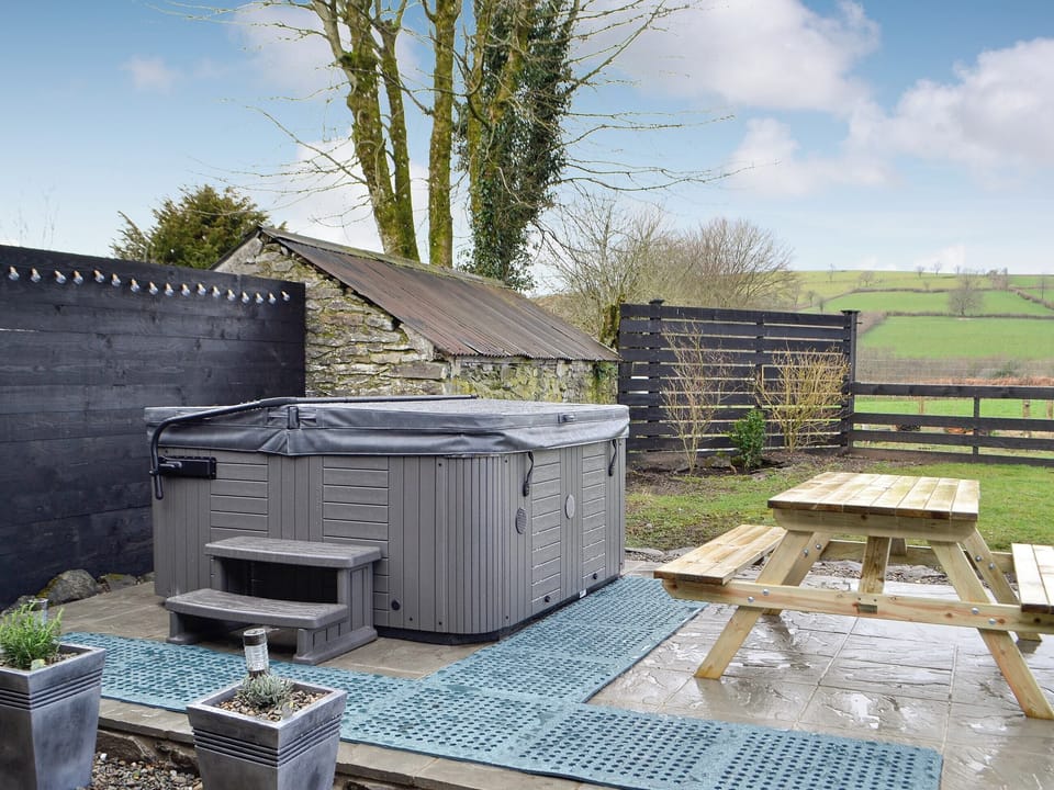 Outdoor area with hot tub | Trefechan, Pumpsaint