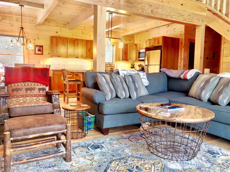 A sunny open concept space that connects the living area and dining area.