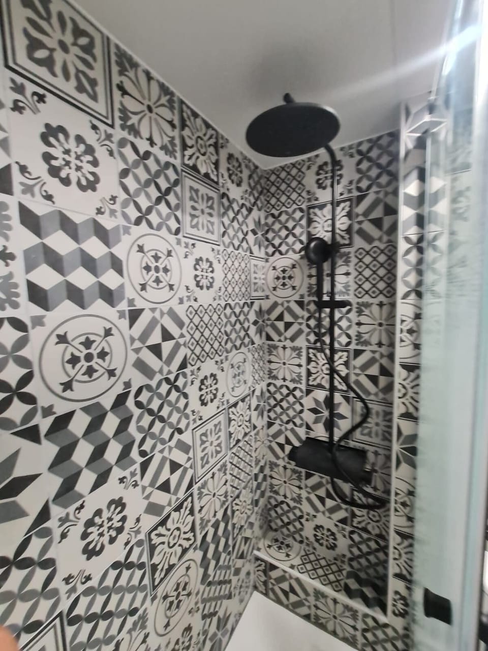 With a big shower head and small movable shower head