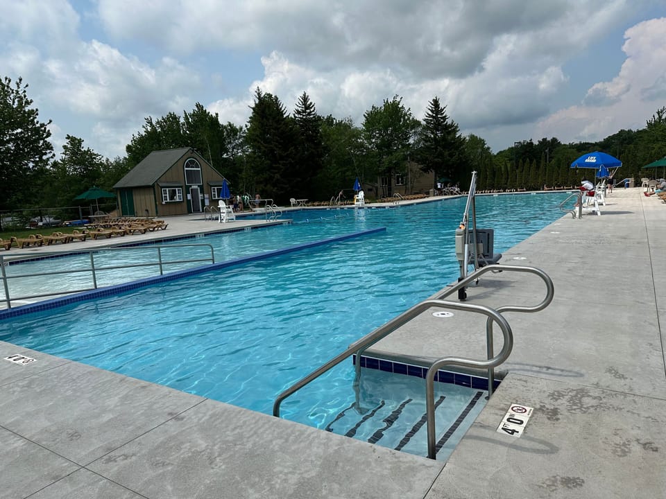 50 meter pool with lifeguard on duty at all times while open.