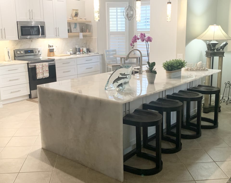 Gorgeous bright kitchen. High end quartzite countertops and soft close drawers.