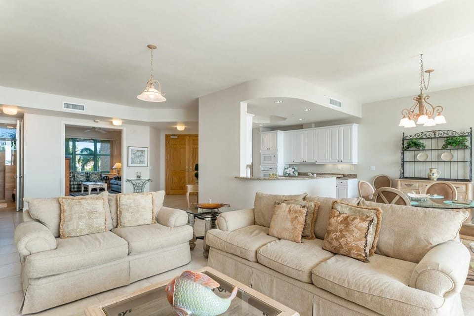 Living room view to entry and den