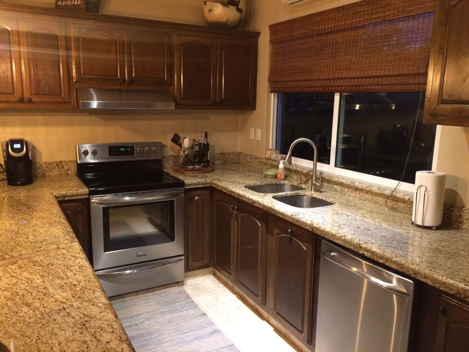 Fully stocked kitchen with stainless steel appliances