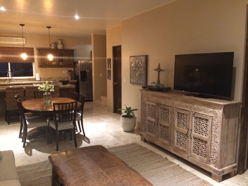 Living Room TV, Dining Table and Kitchen