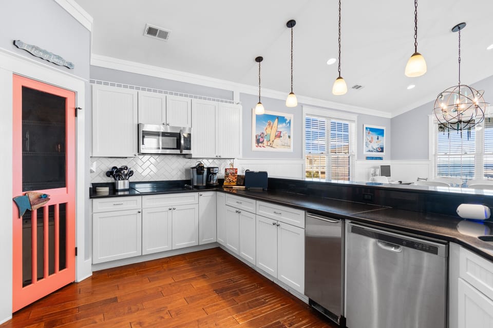 Your spacious kitchen features gleaming granite counters, stainless appliances, and charming pendant lighting for memorable home-cooked meals.