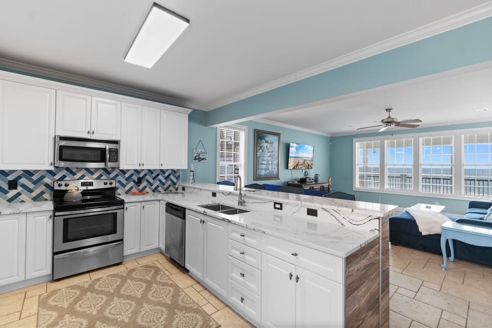 Your spacious kitchen features a stunning sea view, perfect for preparing meals while enjoying the coastal scenery.