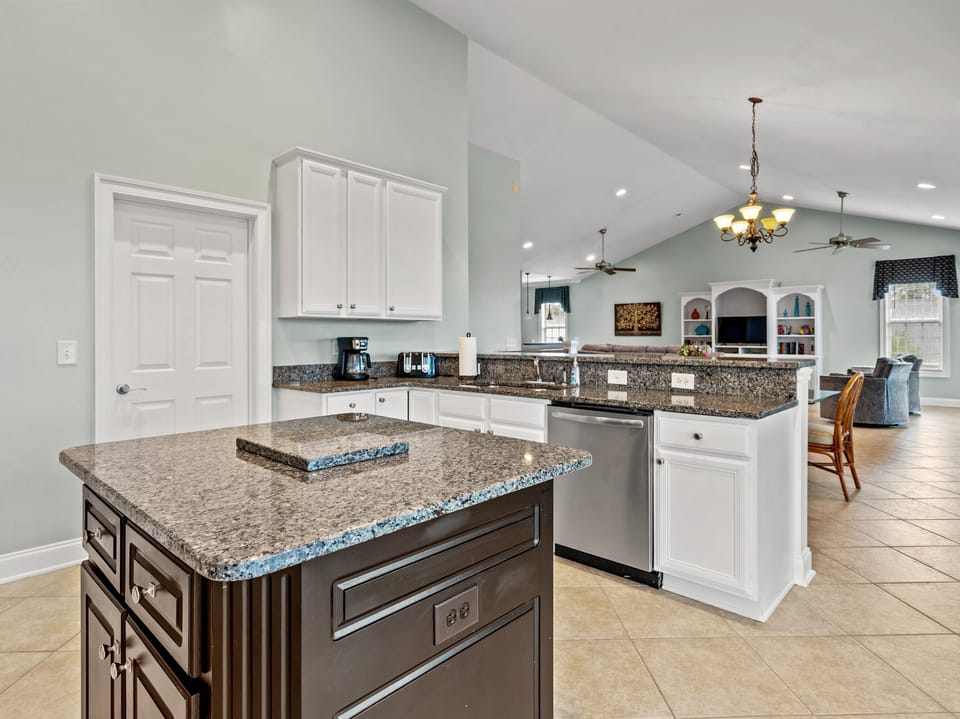 Step into your spacious gourmet kitchen featuring granite countertops, premium appliances, and an open layout perfect for gathering.