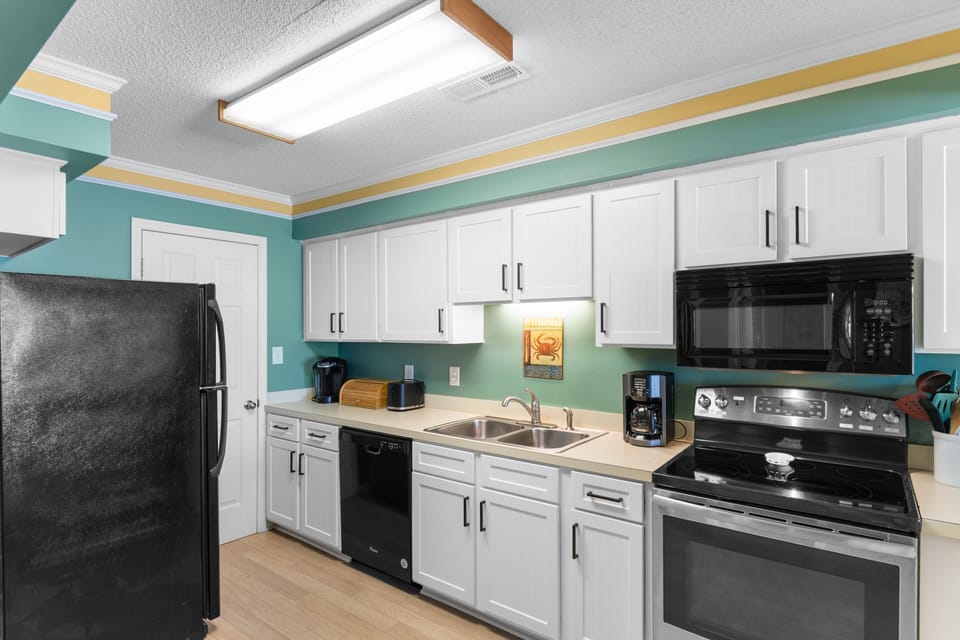 Your fully equipped kitchen has everything you need to whip up your favorite meals. Bright cabinetry, modern appliances, and a cheerful palette invite you to gather, cook, and linger over morning coffee.