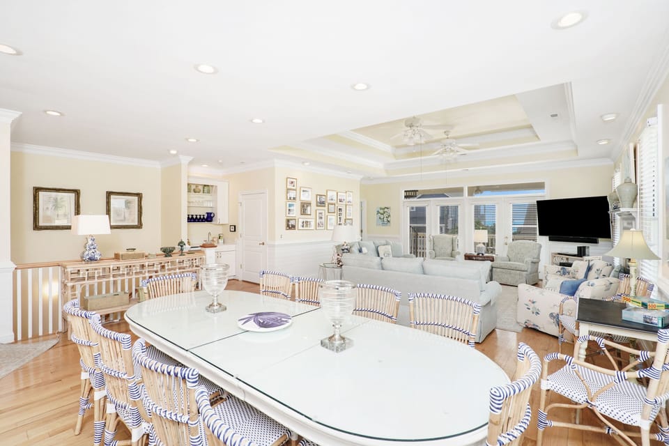 Gather around this stunning dining space where coastal elegance meets comfort. Your group will love sharing meals at the spacious table.