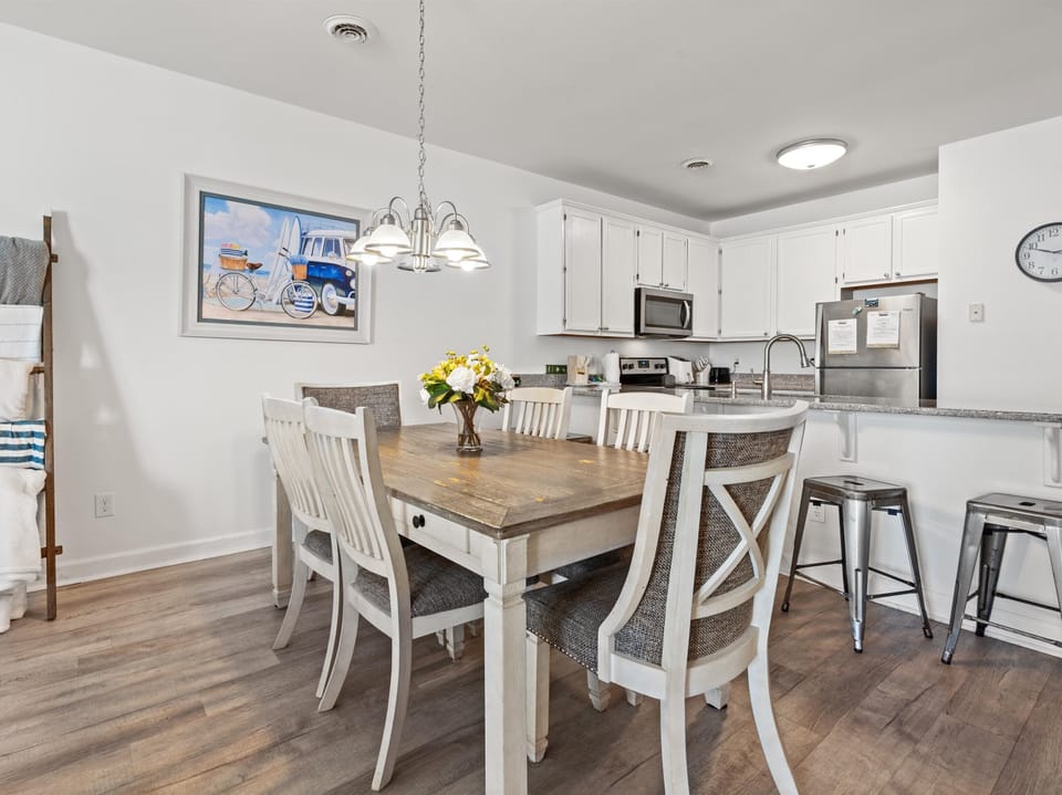 Gather around your bright, beachy dining space where coastal charm meets modern convenience for memorable meals together.
