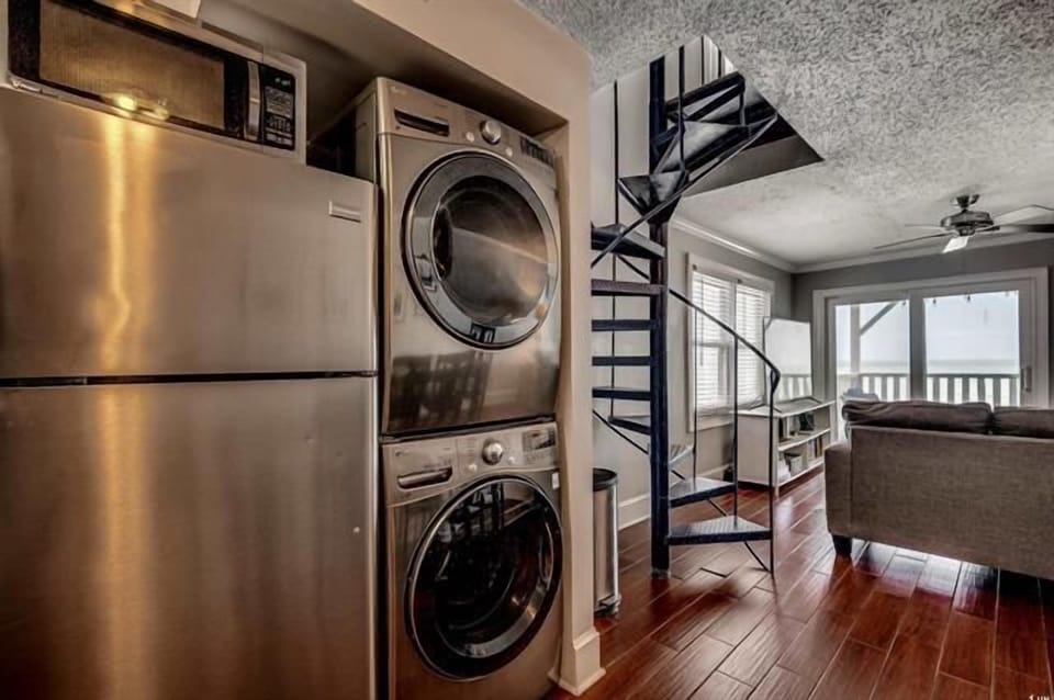 Your in-unit washer and dryer make extended stays effortless while spiral stairs add architectural charm to your modern retreat.
