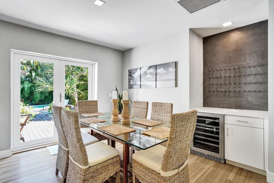 Indoor dining, wine rack and wine fridge...oh yeah, nice view of the backyard.