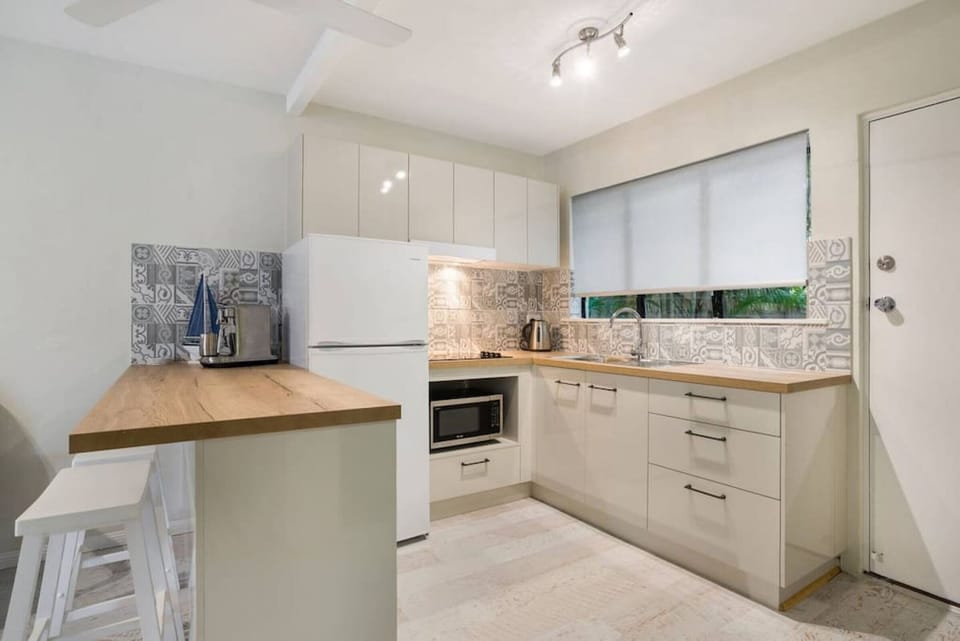 Relax in style with a charming kitchen, perfect for culinary adventures in the heart of the Palm Cove