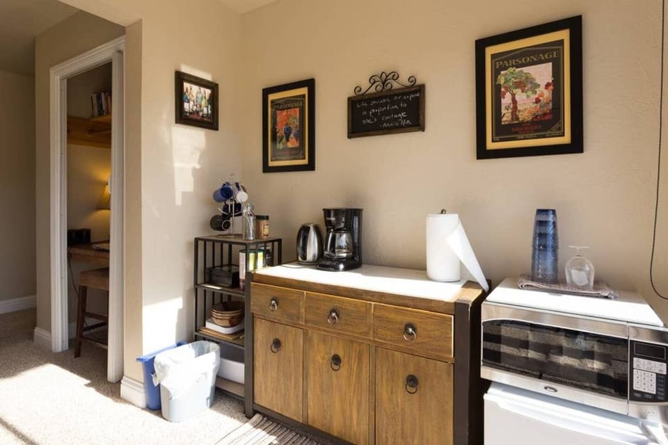 Self-serve breakfast snacks with microwave. Large fridge with ice in tiled-room.