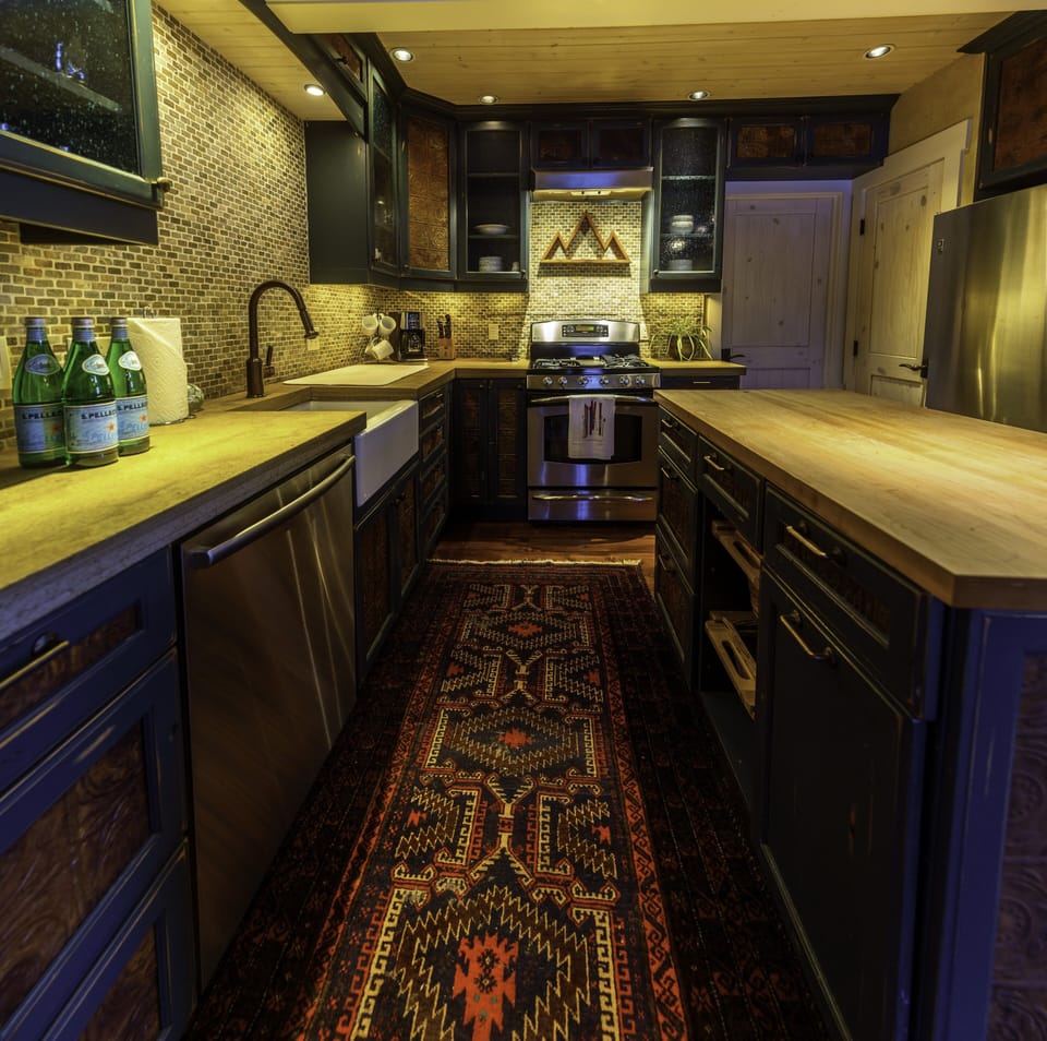 Fully stocked kitchen with stainless steel Kitchen Aide appliances. 