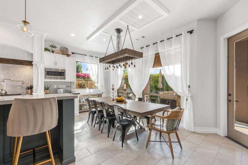 Dining Area with Seating for 10.

Set the mood right with our one of a kind custom chandelier and create ambience of soothing lights and experience a sparkling Dining moment to last. 