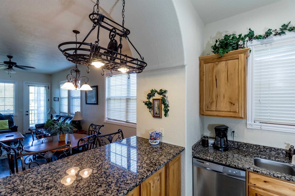 Modern kitchen with granite counters and full-size appliances