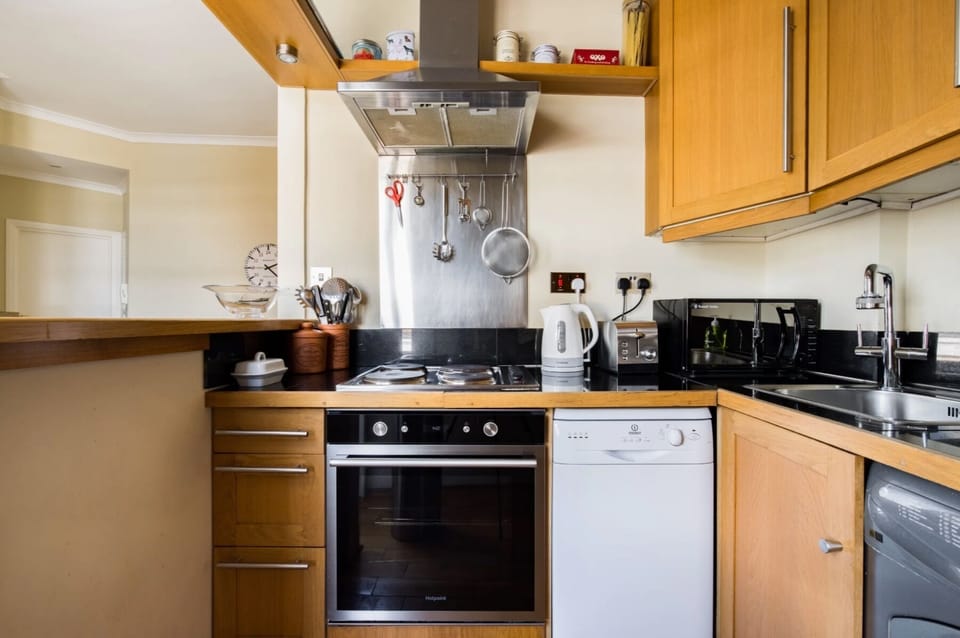 Kitchen attached to dining area with serving 'bar' and ensuite serving area 