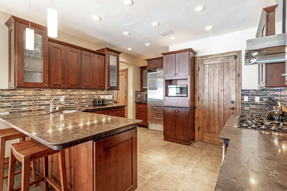 Enjoy creating meals in this fully equipped kitchen with stainless appliances.