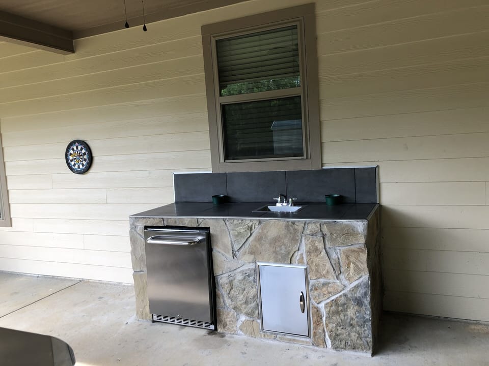 Outdoor Kitchen refrigerator and sink.